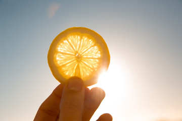 Sun behind lemon slice