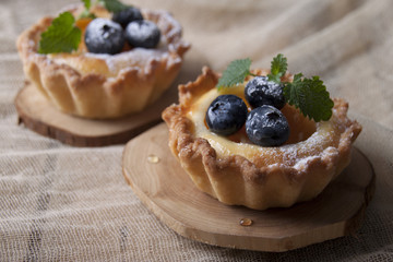 Shortbread baskets with curd cream, apricot and blueberry