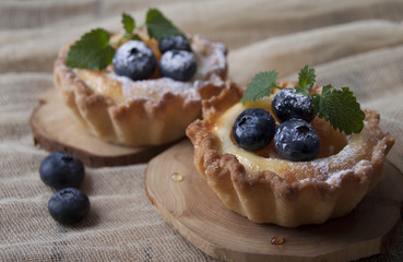 Shortbread baskets with curd cream, apricot and blueberry