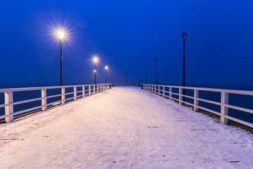 Snowy pier at Baltic Sea in Gdansk, Poland