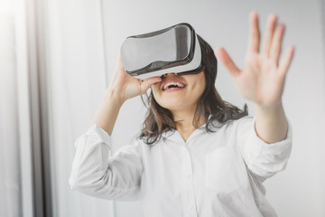woman having fun while wearing VR headset