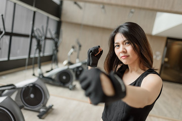 Fototapeta na wymiar woman training boxing exercise with gloves
