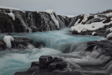 Inside Bruearfoss blue waterfall in Iceland