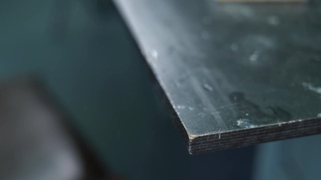 Close-up, Hands of the Pupil Boy Peel Jigsaw Wooden Billet, Detail for the Aircraft Model in the Training Class