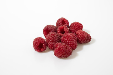 Rasberries in a white background composition