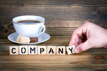 company. Wooden letters on the office desk, informative and communication background.