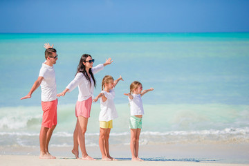 Young family on vacation on caribbean beach