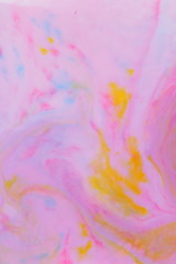 Abstract multicolored background, pink watercolor pattern, colored holographic stains on liquid, texture of pop art, minimalistic background for designer, holographic paint in liquid