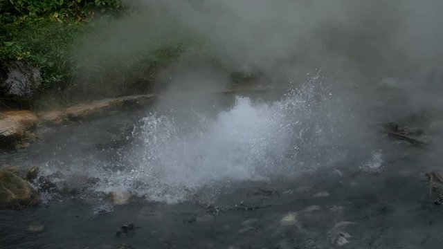 Hot springs (Geyser type) with rocks and green jungle.Pongduet Pa Pae Hotspring, Chiang Mai Province,Thailand 