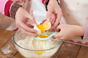 Mother and daughter cook at home. Kitchen interior, healthy food concept