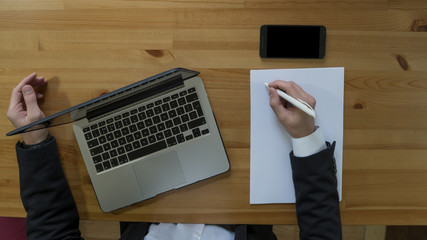 Overhead of man at his desk