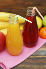 Fresh organic fruit Juice in glass Bottle on rustic wooden wood Background. Healthy life living Diet and fitness.
