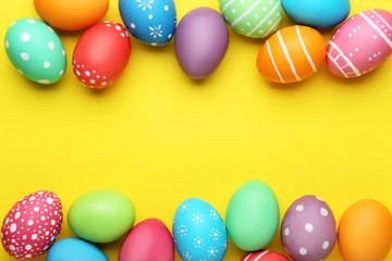 Fototapeta na wymiar Colorful easter eggs on yellow background