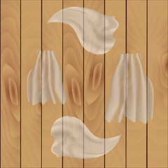 Waving light transparent fabric on a wooden background