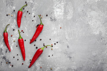 Red chili pepper on grey wooden table