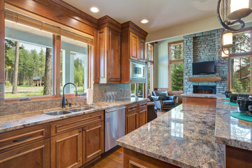 Gourmet kitchen boasts a curved kitchen hood