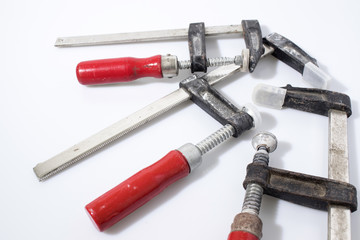 Clamps for wood in a white background composition