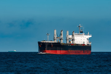 Obraz premium Black cargo ship