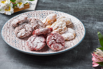 Chocolate 'Red velvet crinkles' cookies in powdered sugar