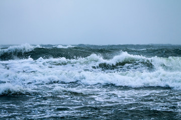 Sea waves breaking during strong wind 