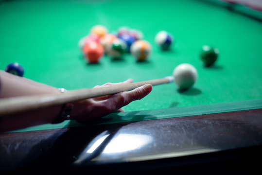 Woman hands playing pool