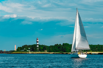 White sailboat traveling at Riga