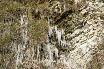 frosty icicles on the rocks