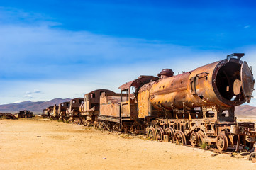 Fototapeta na wymiar Viewon rusty train cemetery by Uyuni in Bolivia