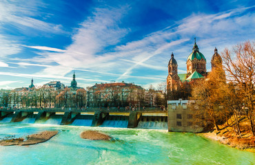 View on winter landscape by turquoise Isar and St. Anna church in Munich - obrazy, fototapety, plakaty