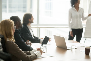 Diverse business people executive team listening to presentation, multiracial businesspeople...