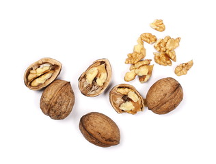 Cracked walnuts isolated on white background, top view