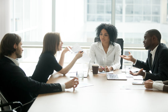 Diverse business partners arguing about bad contract at meeting in lawyers office, disgruntled clients disputing about scam fraud in law firm, cheated investors having claims dissatisfied with loan