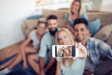 Group of friends taking selfie