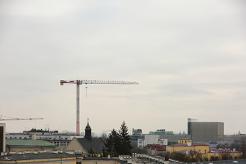 Fototapeta na wymiar Construction crane on the tel panorama of the city of Lublin.