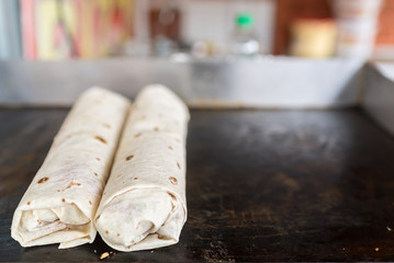 Two shawarms on the grill, traditional turkish meat