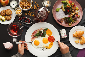 Restaurant breakfast with bacon and fried eggs
