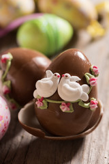 Decorated Chocolate easter egg on wooden table