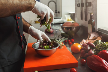 Chef making fresh vegetables mix salad