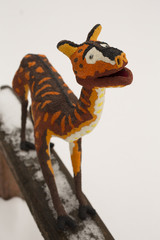 A decorative sculpture of a procamelus. A toy made of Papier-mache. Motley beast.