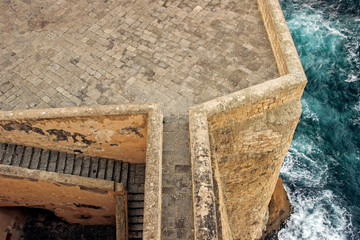 Aerial view of Castel dell'Ovo with blue ocean in Naples, Italy 