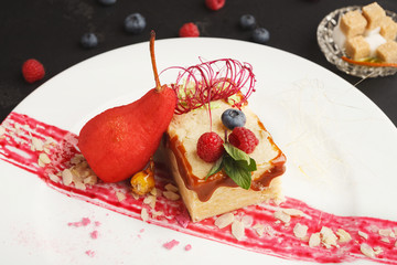 Exclusive dessert served on white plate, closeup