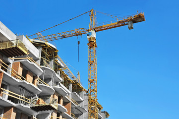 Crane and highrise construction site