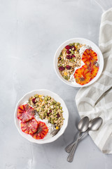 Healthy morning breakfast with granola yogurt blood oranges