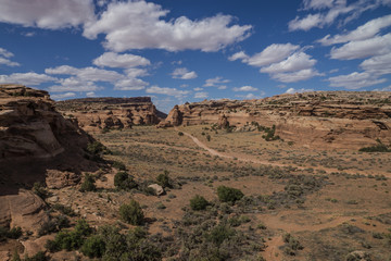 Fototapeta premium A narrow dirt road passing between two mesas