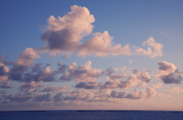 Fototapeta na wymiar Cumulus Clouds above South Pacific Ocean at Sunset
