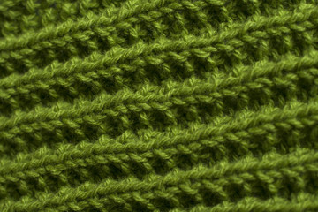 Green knitting fabric texture background or knitted pattern background