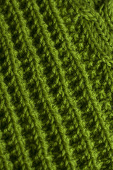 Green knitting fabric texture background or knitted pattern background