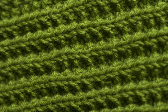 Green knitting fabric texture background or knitted pattern background