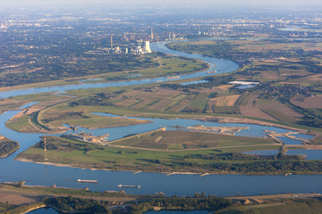 Rhine River bend with agricultural, industrial and residential districts in the Lower Rhine Region of Germany