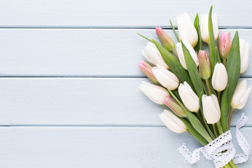 Mother's Day, woman's day, easter, white tulips, presents on gray  background.